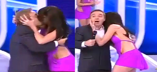 Dançarina dá beijo na boca de Gugu ao vivo durante programa - 